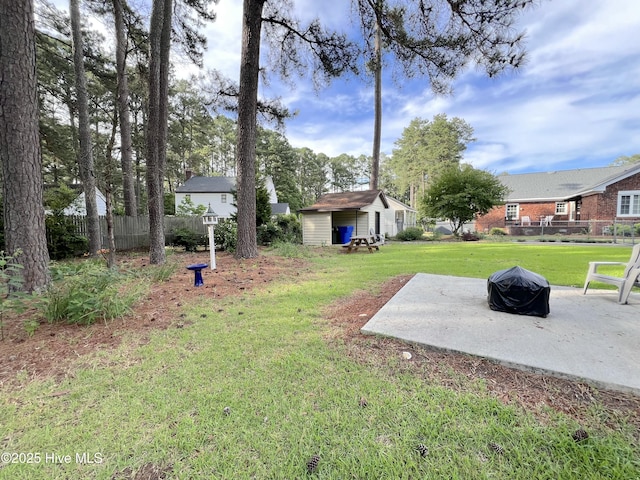 1811 Hermitage Rd NW, Wilson, NC 27896 - view of yard featuring a patio area, an outbuilding, and a fire pit