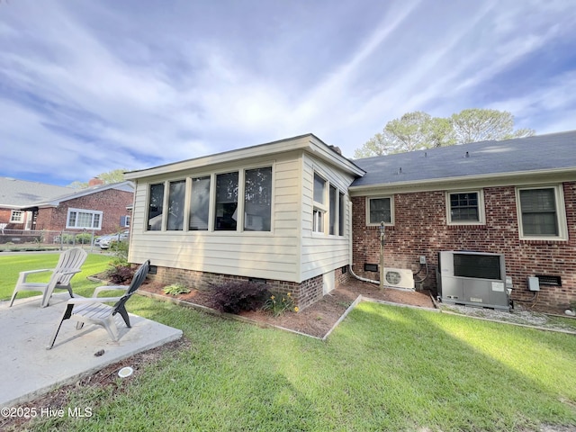 1811 Hermitage Rd NW, Wilson, NC 27896 - back of house with a lawn, a patio area, and cooling unit