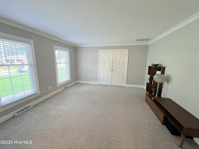 1811 Hermitage Rd NW, Wilson, NC 27896 - bedroom featuring ornamental molding, carpet floors, baseboards, and a closet