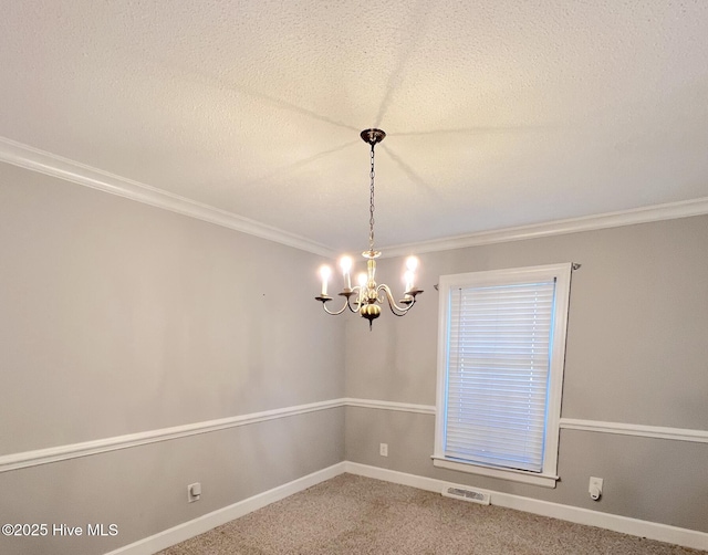 1811 Hermitage Rd NW, Wilson, NC 27896 - spare room with a chandelier, carpet floors, ornamental molding, a textured ceiling, and baseboards