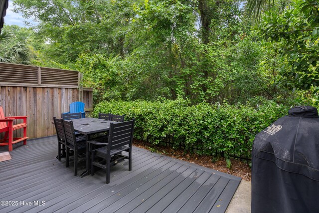 117 Bimini Townes Ln, Carolina Beach, NC 28428 - wooden terrace featuring outdoor dining area and grilling area