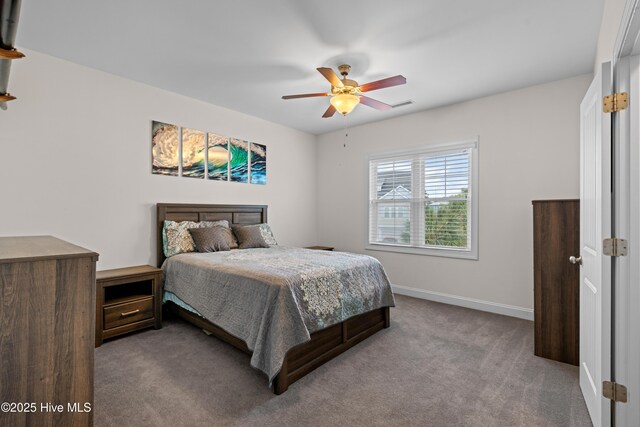 117 Bimini Townes Ln, Carolina Beach, NC 28428 - carpeted bedroom featuring baseboards and a ceiling fan