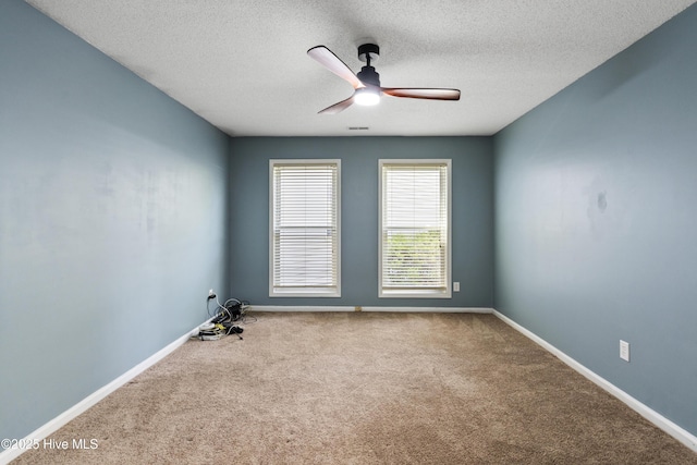 716 Shadowridge Rd, Jacksonville, NC 28546 - carpeted empty room featuring a ceiling fan, a textured ceiling, and baseboards