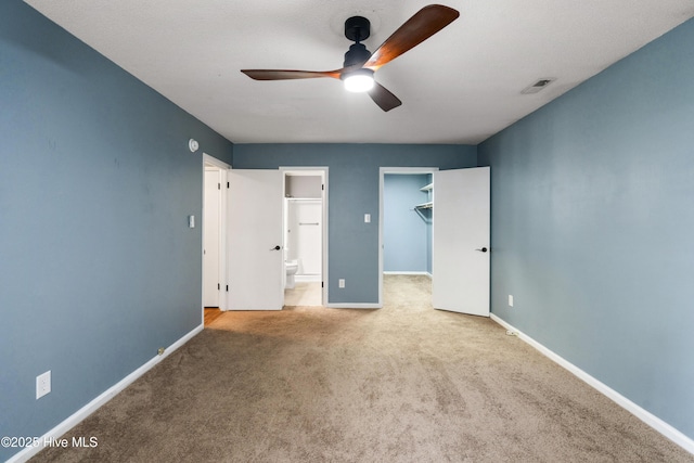 716 Shadowridge Rd, Jacksonville, NC 28546 - unfurnished bedroom featuring carpet flooring, a walk in closet, baseboards, and ensuite bathroom