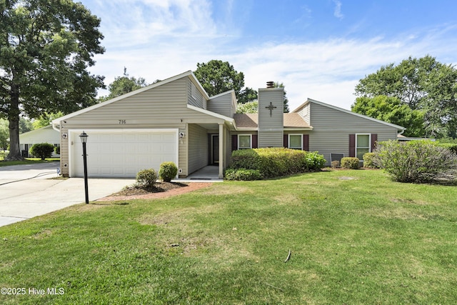 716 Shadowridge Rd, Jacksonville, NC 28546 - mid-century inspired home featuring driveway, a garage, a chimney, and a front lawn