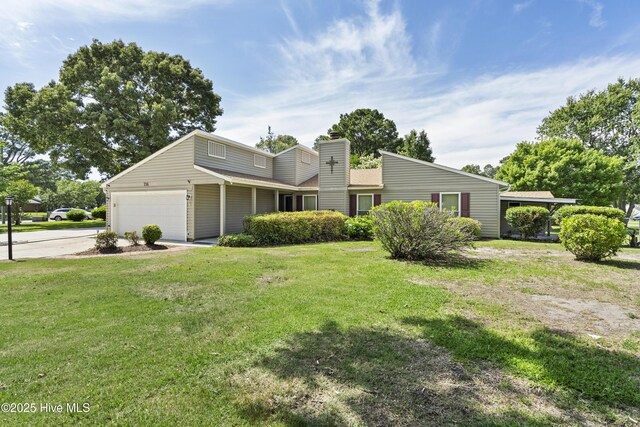 716 Shadowridge Rd, Jacksonville, NC 28546 - view of front of property with a chimney, a front yard, concrete driveway, and a garage