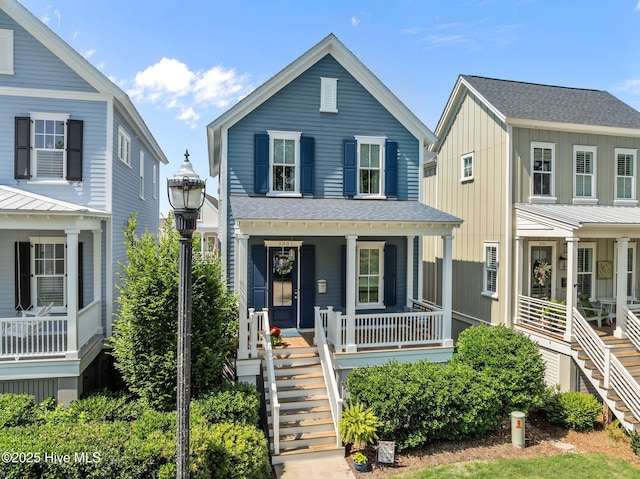 233 E Water St, Washington, NC 27889 - view of front of home with stairs, a porch, and roof with shingles