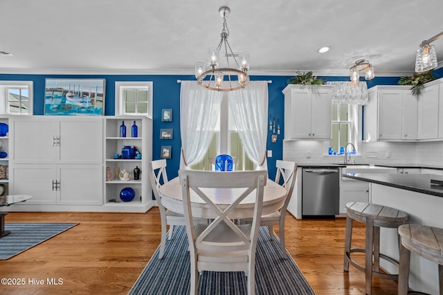 233 E Water St, Washington, NC 27889 - dining room with a chandelier, plenty of natural light, ornamental molding, and light wood-type flooring