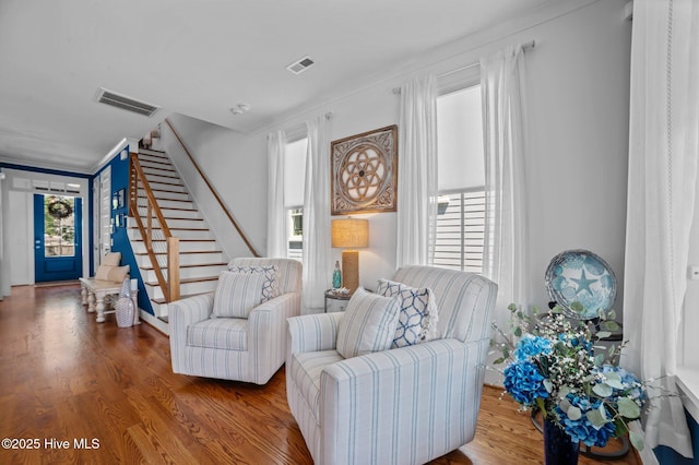 233 E Water St, Washington, NC 27889 - living room featuring stairs, wood finished floors, and crown molding