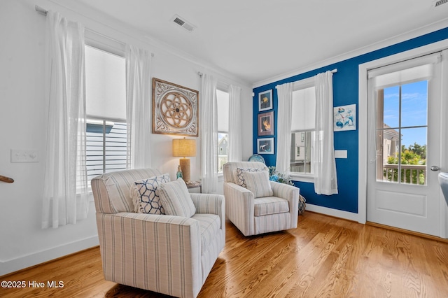 233 E Water St, Washington, NC 27889 - sitting room featuring baseboards, ornamental molding, and wood finished floors