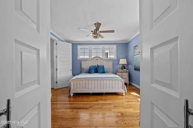 233 E Water St, Washington, NC 27889 - bedroom featuring ornamental molding, wood finished floors, ceiling fan, and baseboards