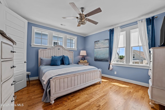 233 E Water St, Washington, NC 27889 - bedroom featuring baseboards, light wood-style floors, and ceiling fan