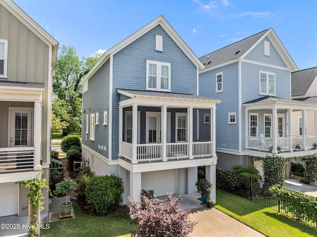 233 E Water St, Washington, NC 27889 - view of front facade with an attached garage, roof with shingles, driveway, and board and batten siding