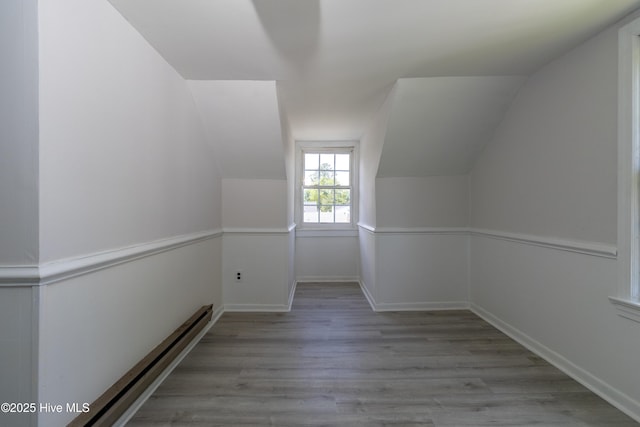 808 Cabarrus St, Edenton, NC 27932 - bonus room with baseboard heating, lofted ceiling, wood finished floors, and baseboards