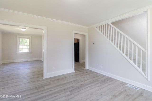 808 Cabarrus St, Edenton, NC 27932 - spare room with wood finished floors, crown molding, stairway, and baseboards