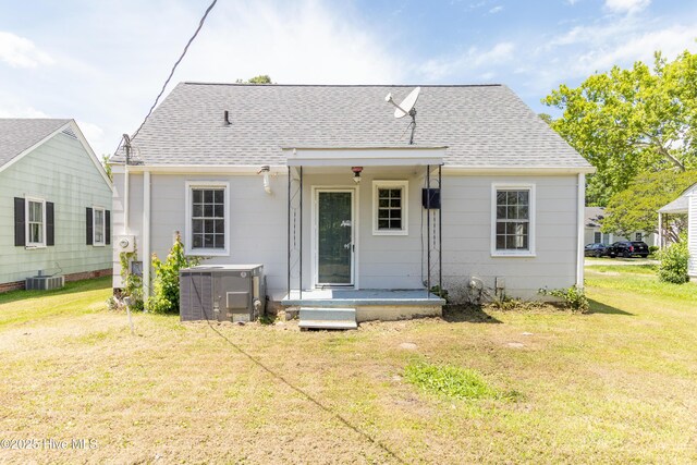 808 Cabarrus St, Edenton, NC 27932 - rear view of house featuring a shingled roof, a yard, and cooling unit