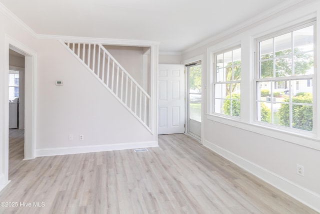 808 Cabarrus St, Edenton, NC 27932 - spare room featuring stairway, ornamental molding, light wood-type flooring, and baseboards