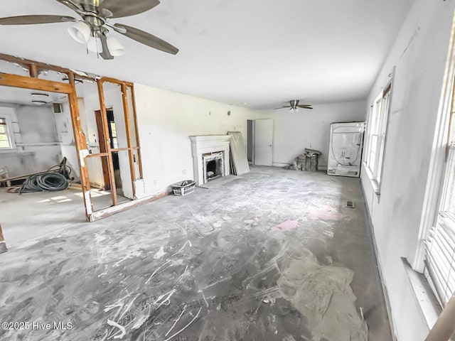 101 W Pearl St, Aulander, NC 27805 - unfurnished living room with a ceiling fan and a fireplace
