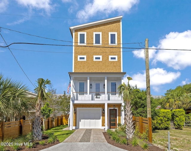 221 Georgia Ave, Carolina Beach, NC 28428 - coastal inspired home with driveway, a garage, and a balcony