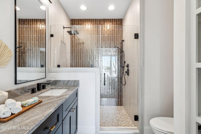 221 Georgia Ave, Carolina Beach, NC 28428 - full bathroom featuring vanity, a stall shower, toilet, and recessed lighting