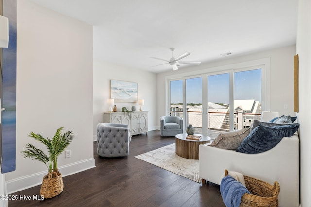 221 Georgia Ave, Carolina Beach, NC 28428 - living area featuring a ceiling fan and dark wood-style flooring