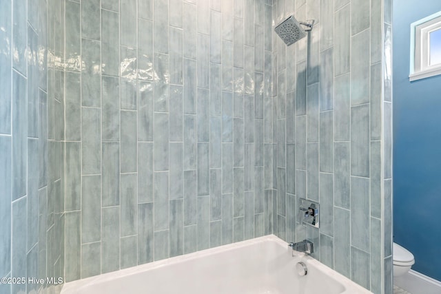 221 Georgia Ave, Carolina Beach, NC 28428 - bathroom with toilet, bathing tub / shower combination, and baseboards
