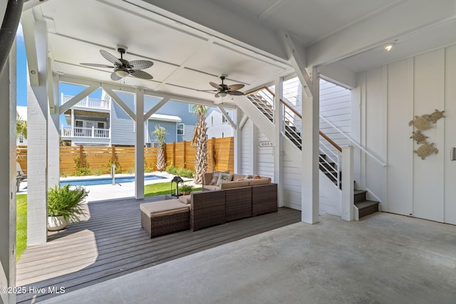 221 Georgia Ave, Carolina Beach, NC 28428 - fenced backyard featuring a ceiling fan, stairway, an outdoor living space, and a patio area