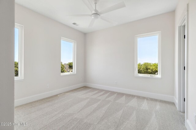 221 Georgia Ave, Carolina Beach, NC 28428 - carpeted empty room featuring baseboards and ceiling fan