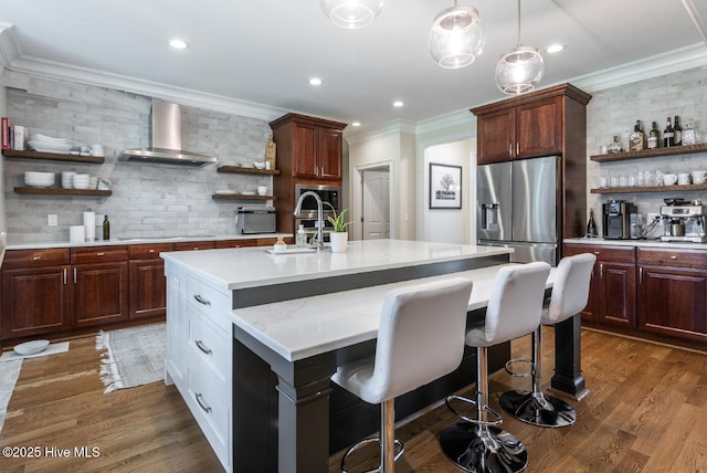 509 Westminster Cir, Greenville, NC 27858 - kitchen with open shelves, wall chimney exhaust hood, stainless steel refrigerator with ice dispenser, backsplash, and ornamental molding