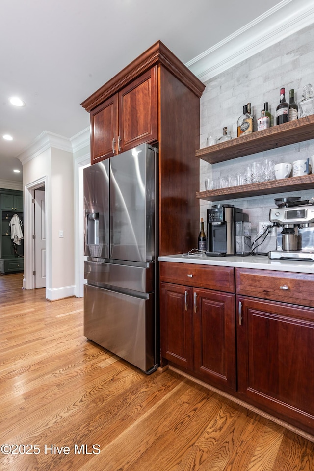 509 Westminster Cir, Greenville, NC 27858 - kitchen featuring stainless steel fridge with ice dispenser, ornamental molding, open shelves, light wood-type flooring, and recessed lighting