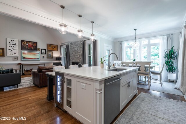 509 Westminster Cir, Greenville, NC 27858 - kitchen with a sink, dishwasher, a kitchen island with sink, white cabinetry, and pendant lighting