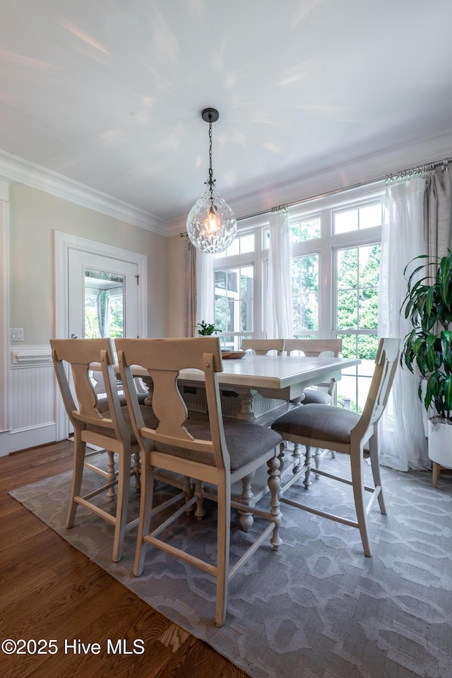 509 Westminster Cir, Greenville, NC 27858 - dining room with healthy amount of natural light, crown molding, and wood finished floors