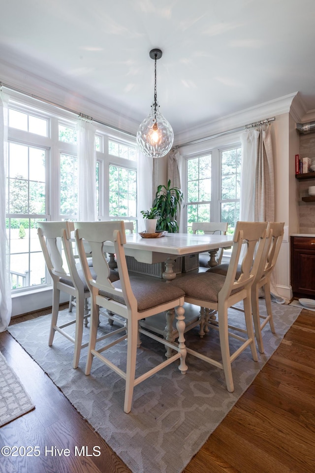 509 Westminster Cir, Greenville, NC 27858 - dining room featuring ornamental molding, healthy amount of natural light, and wood finished floors
