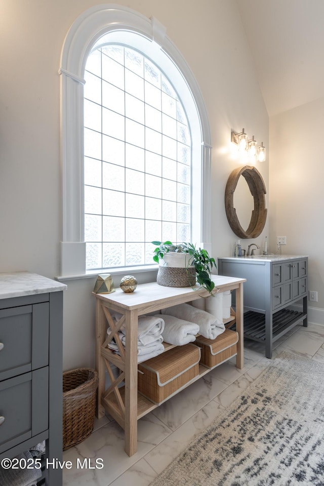 509 Westminster Cir, Greenville, NC 27858 - bathroom with marble finish flooring, lofted ceiling, and vanity