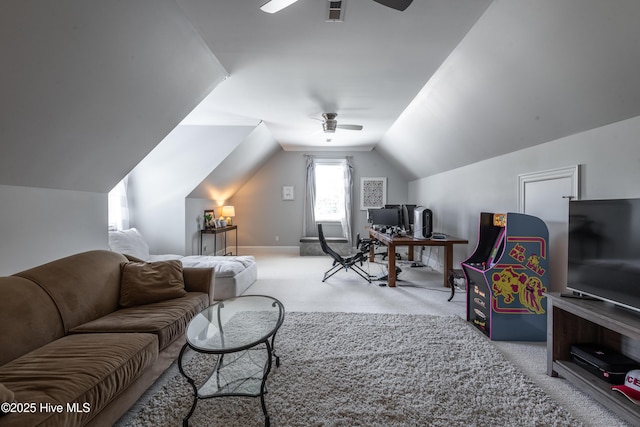 509 Westminster Cir, Greenville, NC 27858 - living room featuring a ceiling fan, carpet flooring, vaulted ceiling, a desk, and baseboards
