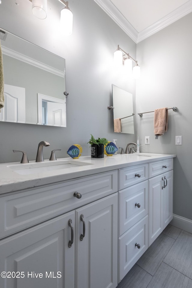 509 Westminster Cir, Greenville, NC 27858 - bathroom featuring ornamental molding, double vanity, baseboards, and wood finished floors