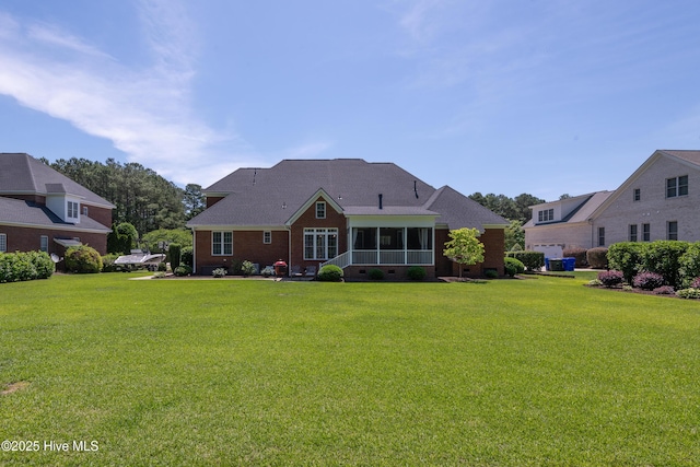 509 Westminster Cir, Greenville, NC 27858 - rear view of house with a yard, a sunroom, brick siding, and crawl space