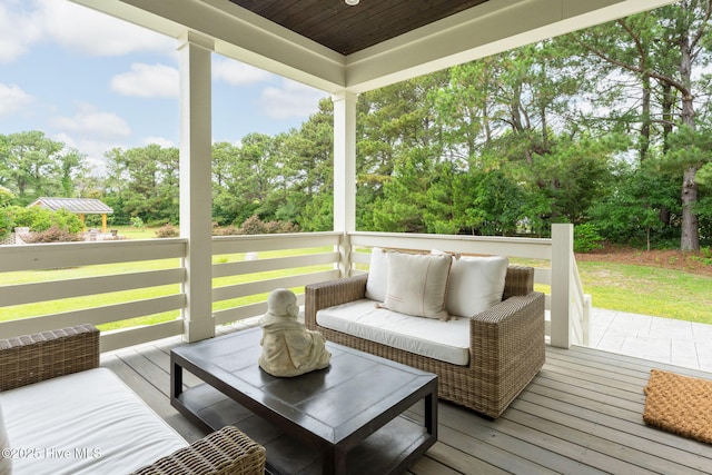 204 N Sea Lily Ct, Hampstead, NC 28443 - wooden terrace with view of scattered trees