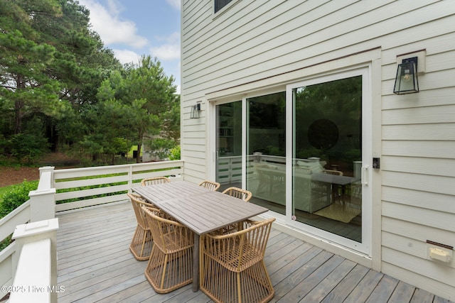 204 N Sea Lily Ct, Hampstead, NC 28443 - wooden deck with outdoor dining area
