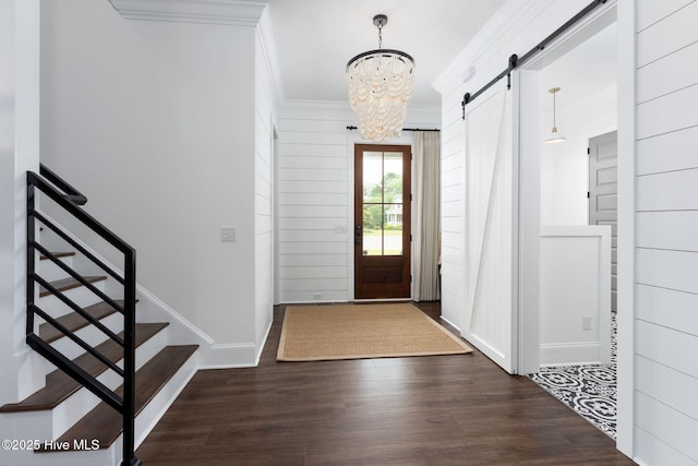 204 N Sea Lily Ct, Hampstead, NC 28443 - entrance foyer with a barn door, crown molding, a chandelier, stairway, and wood finished floors