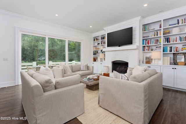 204 N Sea Lily Ct, Hampstead, NC 28443 - living area with a fireplace, ornamental molding, wood finished floors, recessed lighting, and built in shelves