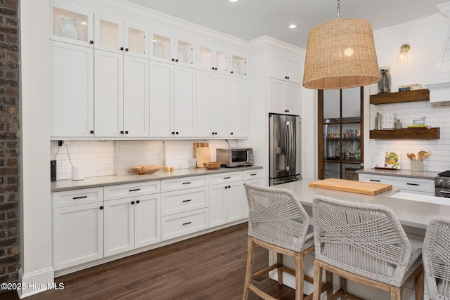 204 N Sea Lily Ct, Hampstead, NC 28443 - kitchen featuring stainless steel fridge, open shelves, white cabinets, dark wood-style floors, and recessed lighting