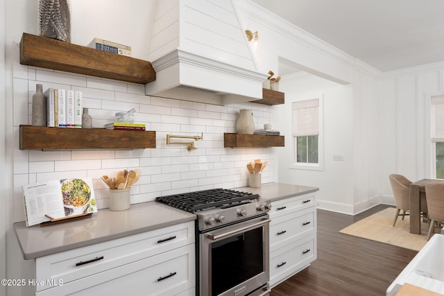 204 N Sea Lily Ct, Hampstead, NC 28443 - kitchen featuring stainless steel gas range oven, open shelves, backsplash, dark wood finished floors, and white cabinetry