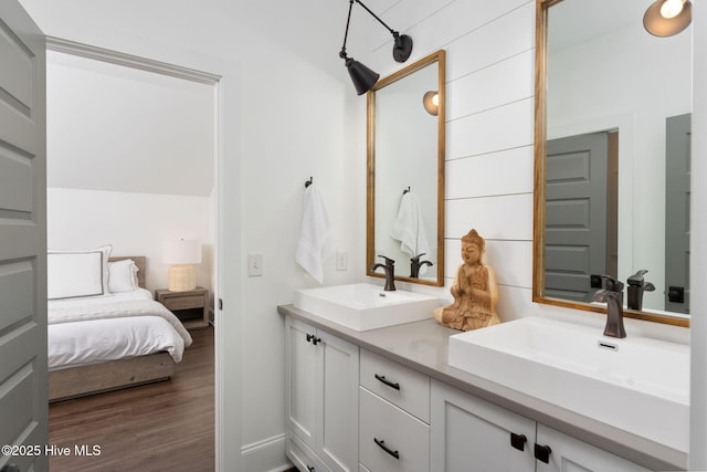 204 N Sea Lily Ct, Hampstead, NC 28443 - ensuite bathroom with double vanity and wood finished floors