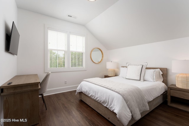 204 N Sea Lily Ct, Hampstead, NC 28443 - bedroom featuring wood finished floors, vaulted ceiling, and baseboards