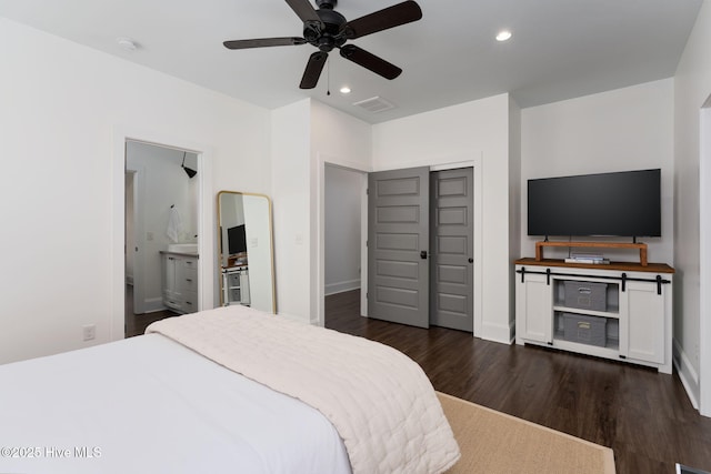 204 N Sea Lily Ct, Hampstead, NC 28443 - bedroom with dark wood-style floors, recessed lighting, ensuite bathroom, ceiling fan, and baseboards