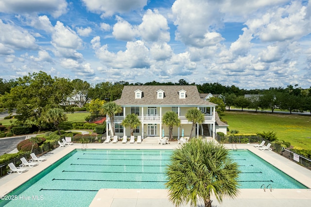 204 N Sea Lily Ct, Hampstead, NC 28443 - back of property with a patio, a community pool, and stairs