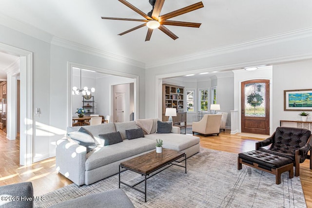 177 National Dr, Pinehurst, NC 28374 - living area with crown molding, light wood-style floors, a ceiling fan, a chandelier, and baseboards