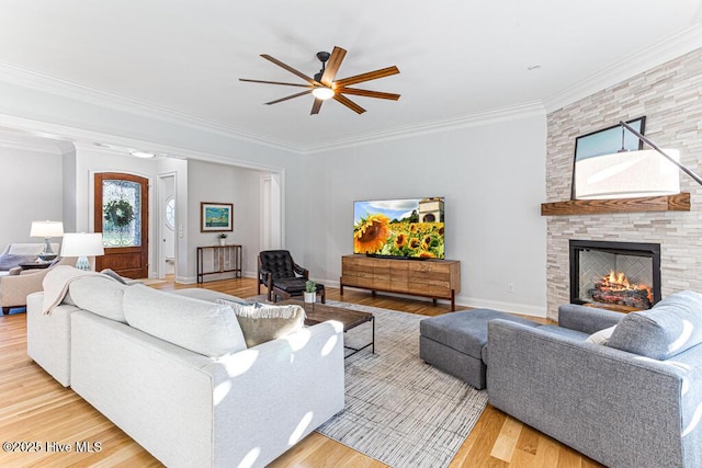 177 National Dr, Pinehurst, NC 28374 - living area with a ceiling fan, a fireplace, wood finished floors, crown molding, and baseboards