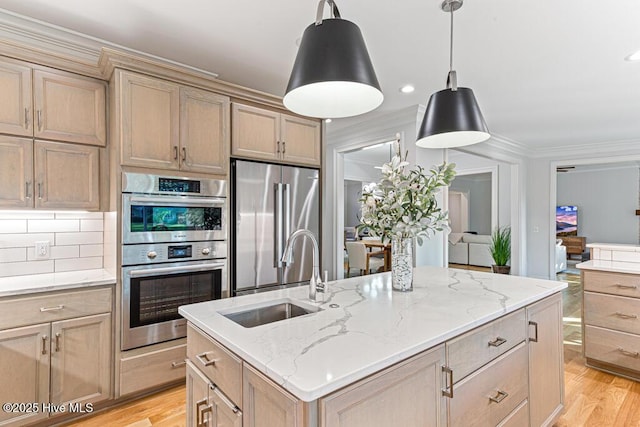 177 National Dr, Pinehurst, NC 28374 - kitchen featuring a sink, stainless steel appliances, light wood finished floors, backsplash, and crown molding